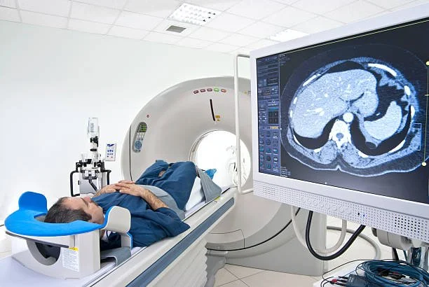 PET CT scanner capturing diagnostic images